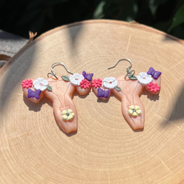 flower uterus girl power earrings