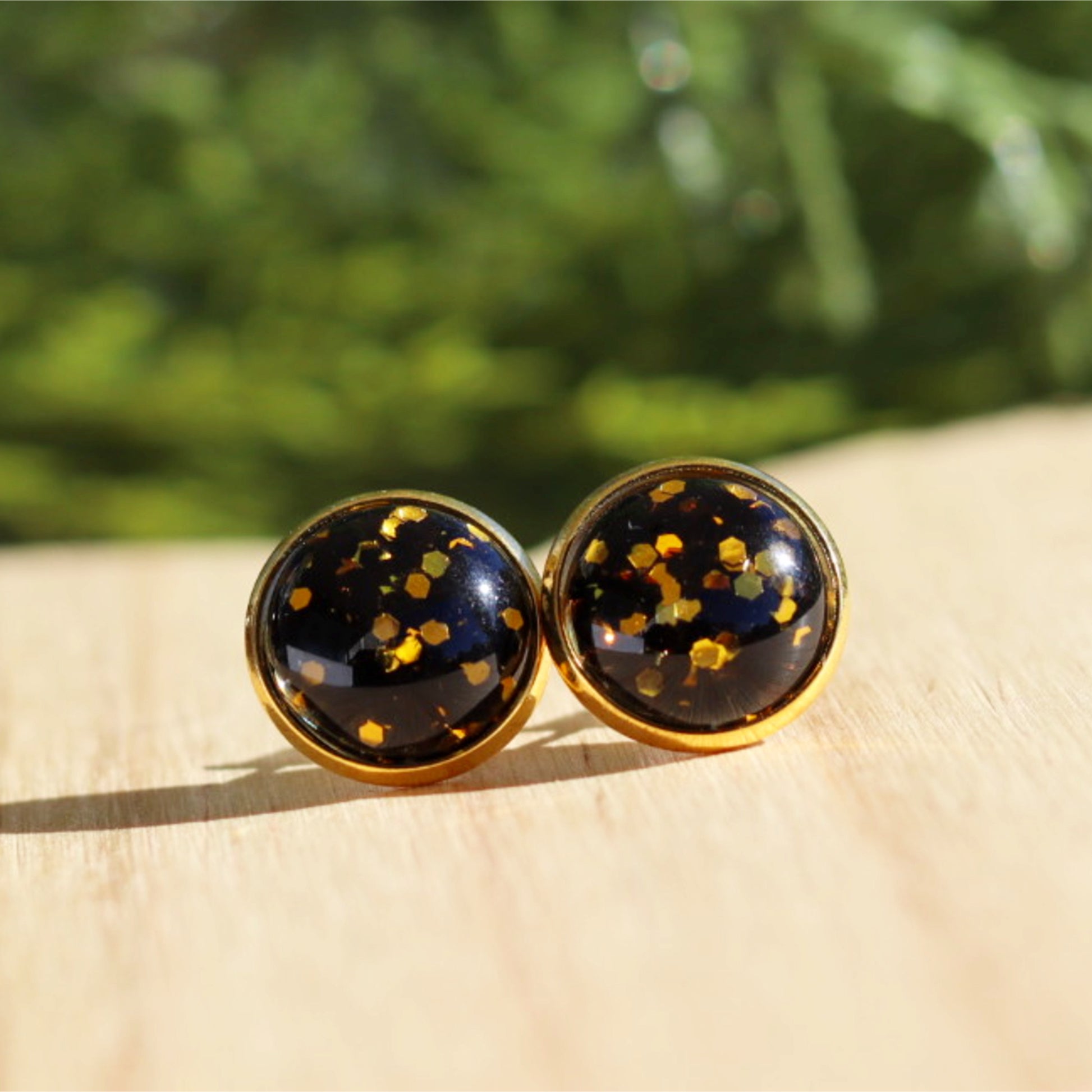 sparkly new years stud earrings gold black