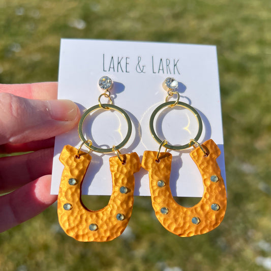 hammered gold lucky horse shoe rhinestone clay earrings